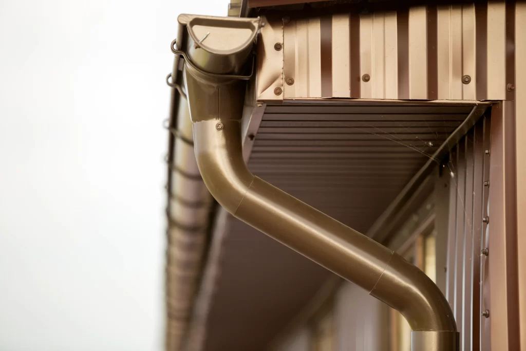 Copper downspouts efficiently direct rainwater away from a home's foundation