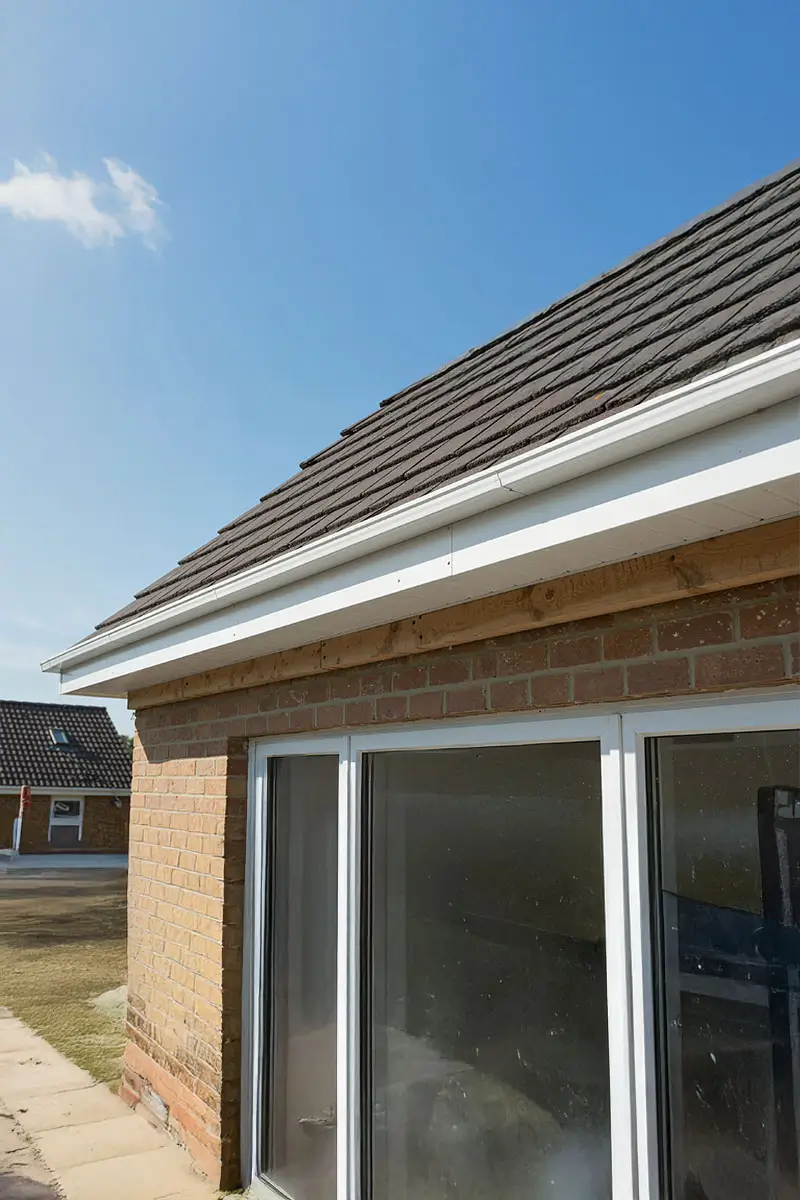 A roof overhang with new fascia board installation, Fixing a Roof.